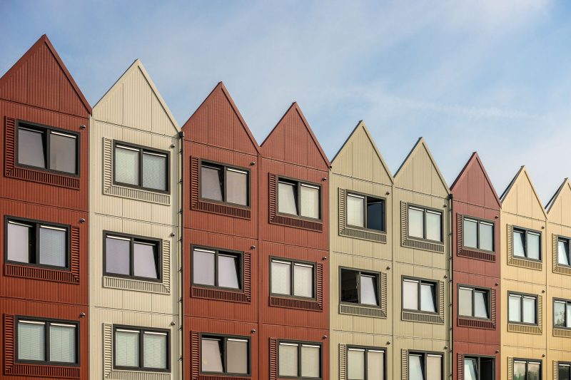 A vibrant row of gableroofed residential buildings with meta 1782838821