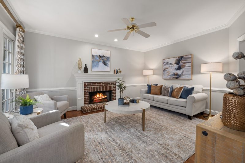 Home 10 A cozy modern living room featuring a fireplace elegant sofa 1788282050